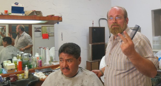 Barber Bruce Connelly with a client at The Barbershop in Odessa, Texas.