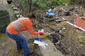 Volunteers clear debris from Onion Creek.