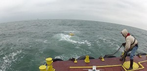 A&M's buoy hits the water and begins sending back data on wind, currents, and waves