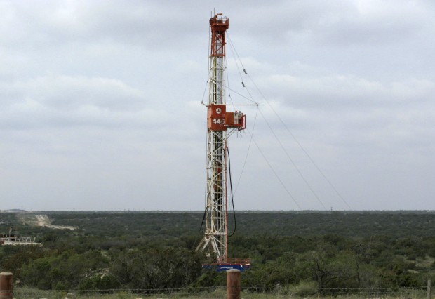A rig contracted by Apache Corp drills a horizontal well in a search for oil and natural gas in the Wolfcamp shale located in the Permian Basin in West Texas. A successful petition in Denton could bring fracking bans to communities around the state. 