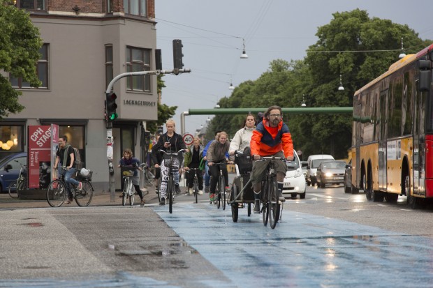 Cyclist commuting in the Copenhagen neighborhood of Norrebro.