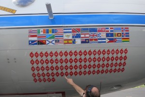 Stickers on the side of the plane commemorate every Hurricane it has flown into. 