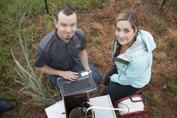 OWRB water resources geologists Derrick Wagner and Jessica Correll analyze readings from their well at the Spencer Mesonet station. 