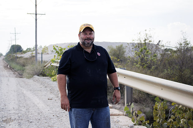 University of Oklahoma professor Bob Nairn stands on a bridge overlooking Tar Creek, which is contaminated with arsenic, cadmium, iron, lead and zinc from decades of mining.