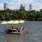 Floaters navigate their homemade raft down the Arkansas River in Tulsa, Okla., during the annual Great Raft Race on Labor Day 2016.