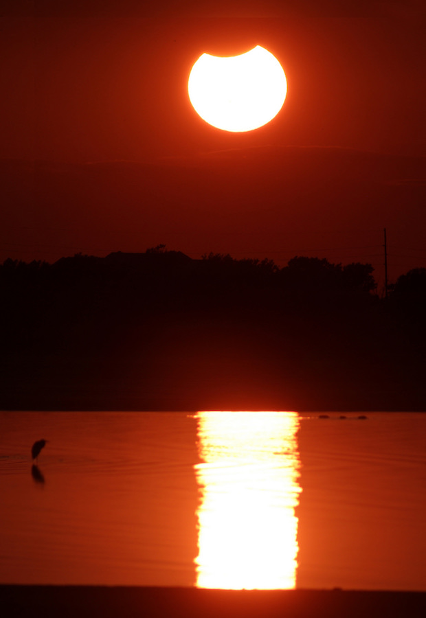 A partial solar eclipse captured over Lake Hefner in Oklahoma City in 2014.