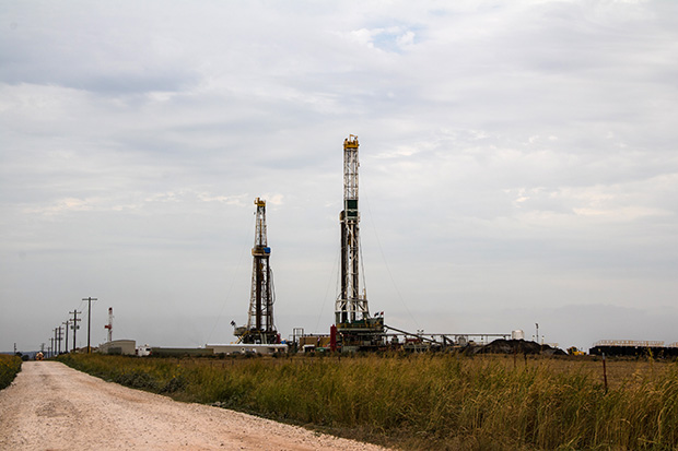 A pair of drilling rigs in Kingfisher County, Okla.