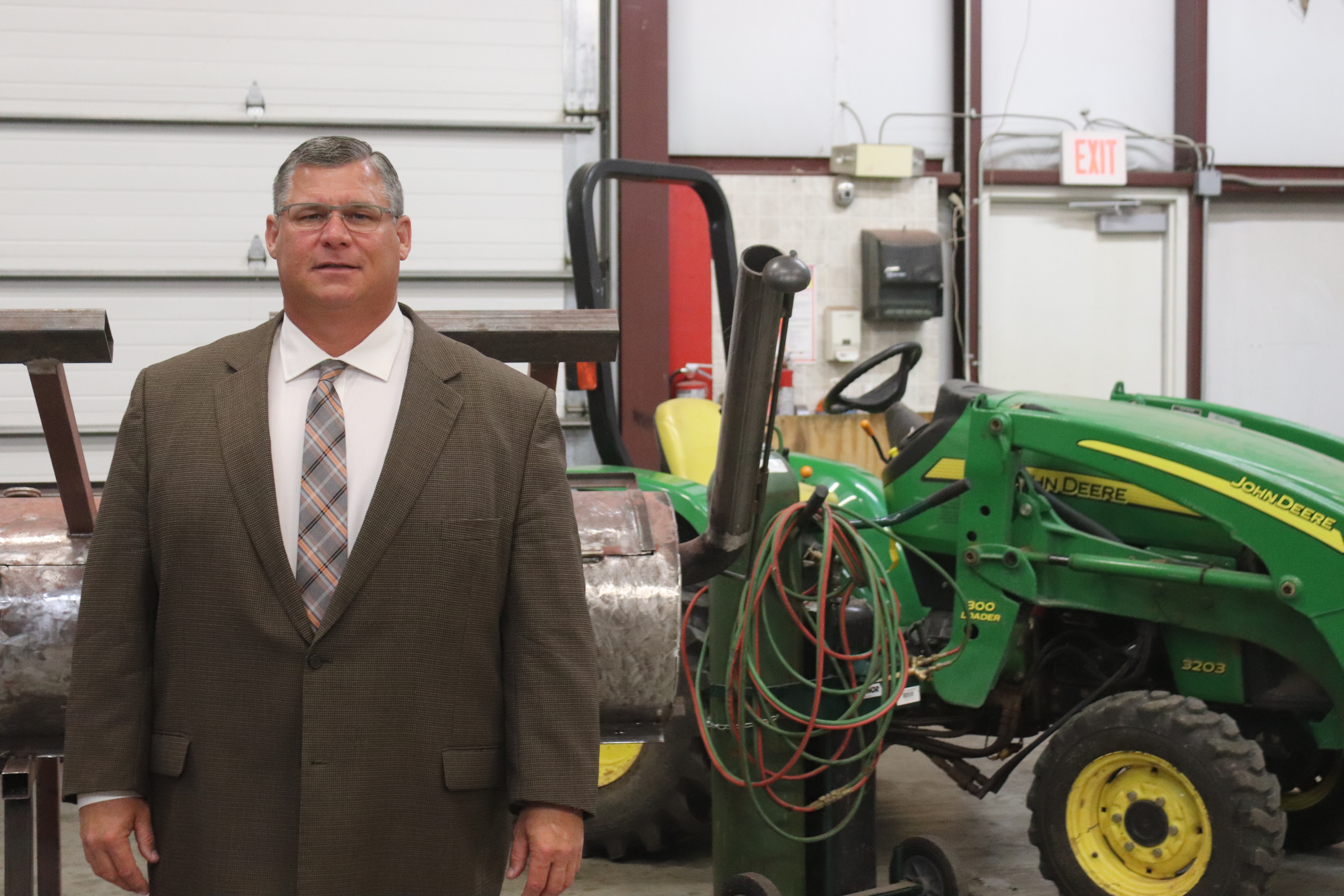 Calumet Public Schools Superintendent Keith Weldon stands in a  garage, that he recently turned into space for an agriculture program. Weldon worries if lawmakers take some of his local funding, he would have to scale back the popular program.  
