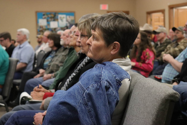 Linnae Colson listens to Jim McBride's presentation at First United Methodist Church.