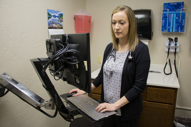 Lindsi Walker, a nurse practitioner, insider her office at Cordell Memorial Hospital.