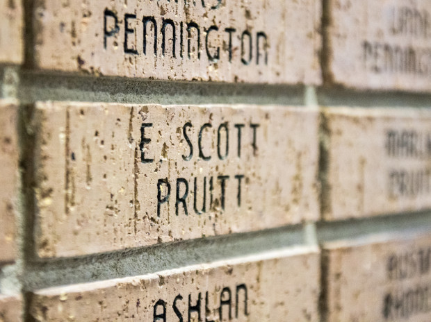 A brick wall at First Baptist Church in Broken Arrow, Okla., is inscribed with the names of people who donated to the church's relocation. Among the names is Scott Pruitt.