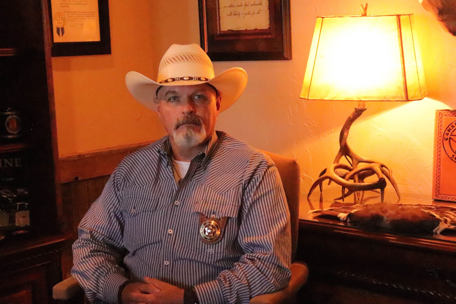 Canadian County Sheriff Chris West sits in his office.