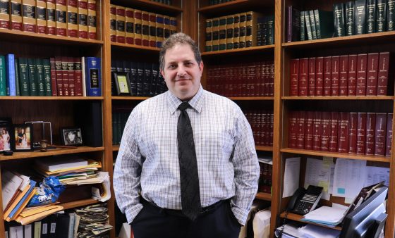 Judge Pickerill stands behind his desk in his courthouse office.