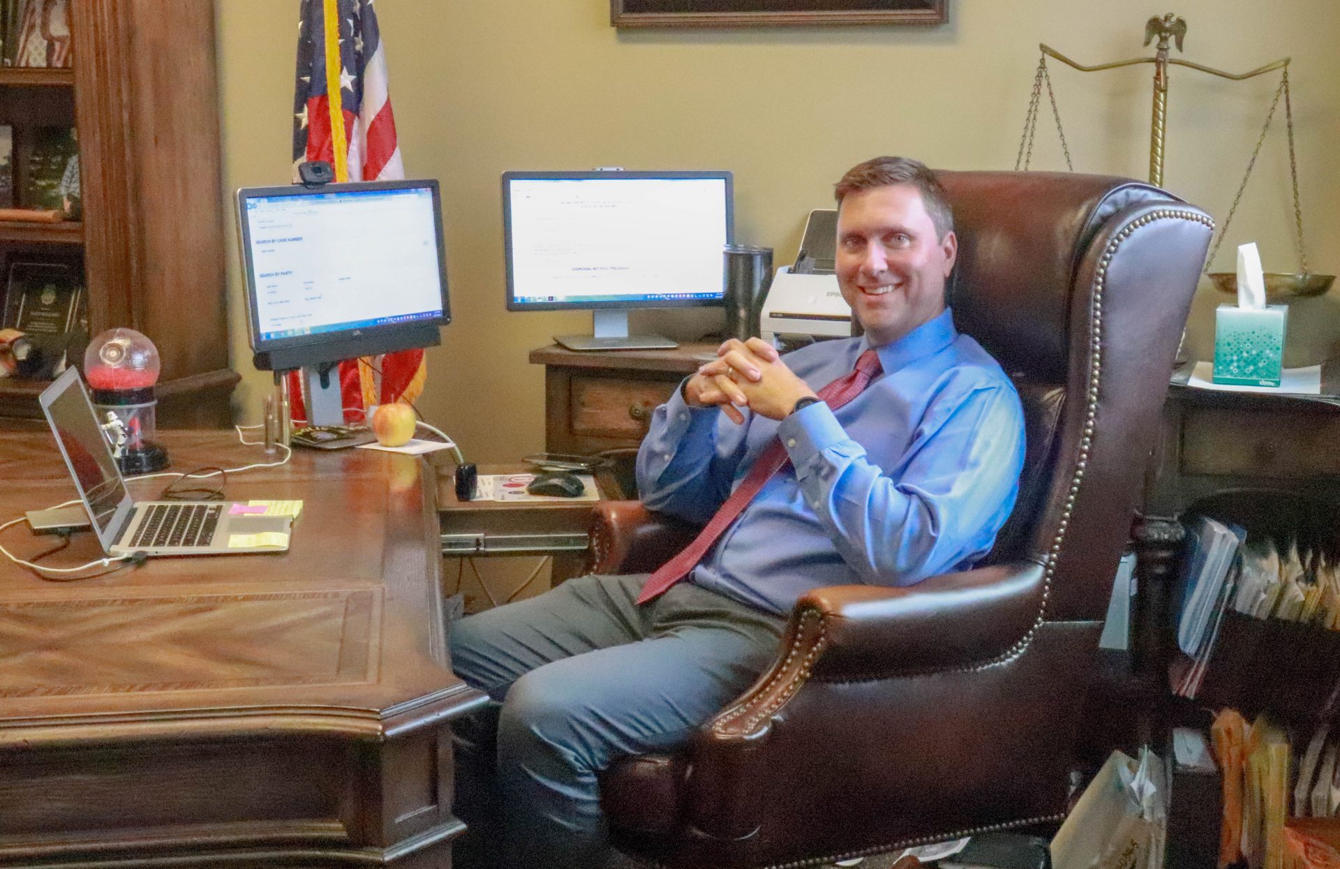 Matt Ballard sits at his desk in the Rogers County District Courthouse.