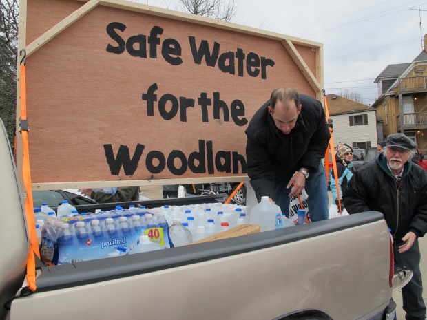 A man helps deliver donations of clean water to residents of Butler County who say gas drilling polluted their water supply, February, 2013.