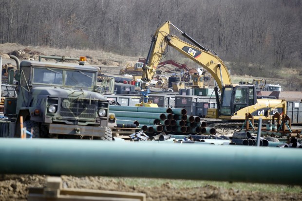 In this Thursday, April 17, 2014 photo, workers continue the construction at a gas pipeline site in Harmony, Pa. Dennis Martire, from the Laborers International Union, or LIUNA, said that the man-hours of union work on large pipeline jobs in Pennsylvania and West Virginia have increased by more than 14 times since 2008.