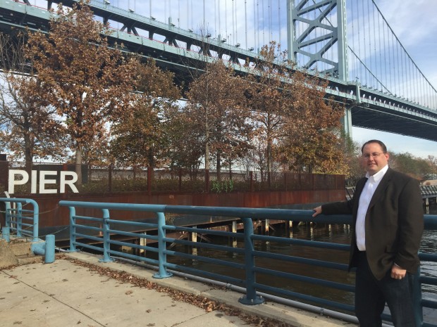 Chris Crockett, deputy commissioner of planning and environmental services for the city of Philadelphia's water department stands by the Delaware river at high tide.