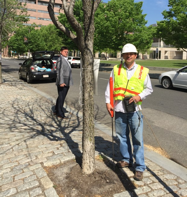 Gas safety consultant Bob Ackley stands next to a dead tree across from the Constitution Center in Philadelphia.