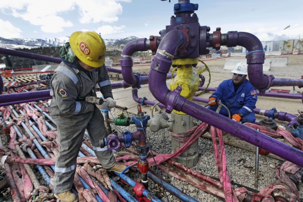 In this March 29, 2013, file photo, workers tend to a well head during a hydraulic fracturing operation outside Rifle, in western Colorado. Two new rules intended to ease tensions over fracking in Colorado will have limited impact, affecting only about 1 percent of the drilling in the state, according to an analysis by state regulators. The Colorado Oil and Gas Conservation Commission is to hold hearings starting Monday, Nov. 16, 2015, on proposals designed to address complaints that arise as Colorados growing suburbs and oilfields collide.