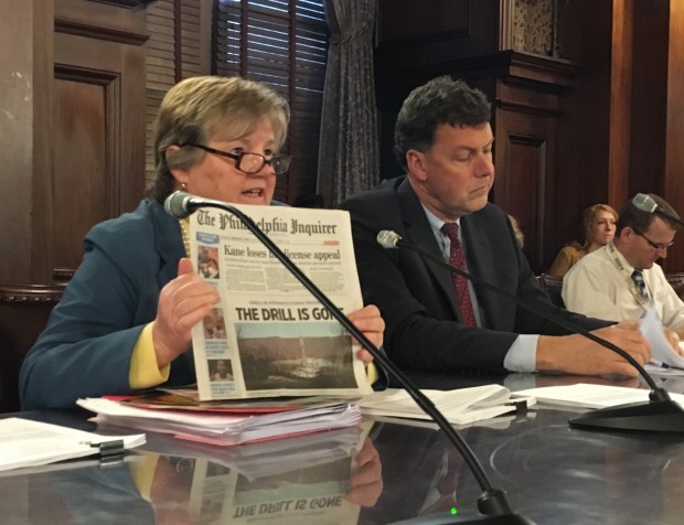 State Rep. Kate Harper (R- Montgomery) holds up a copy of the Philadelphia Inquirer with a story about the downturn in drilling.