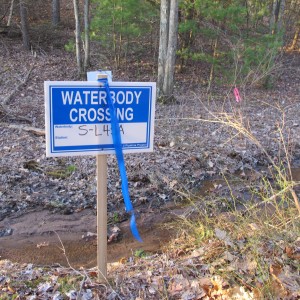 A sign marks a water crossing on the Gerhart's land. Sunoco will be cutting trees along the pipeline path while the case is still on appeal.