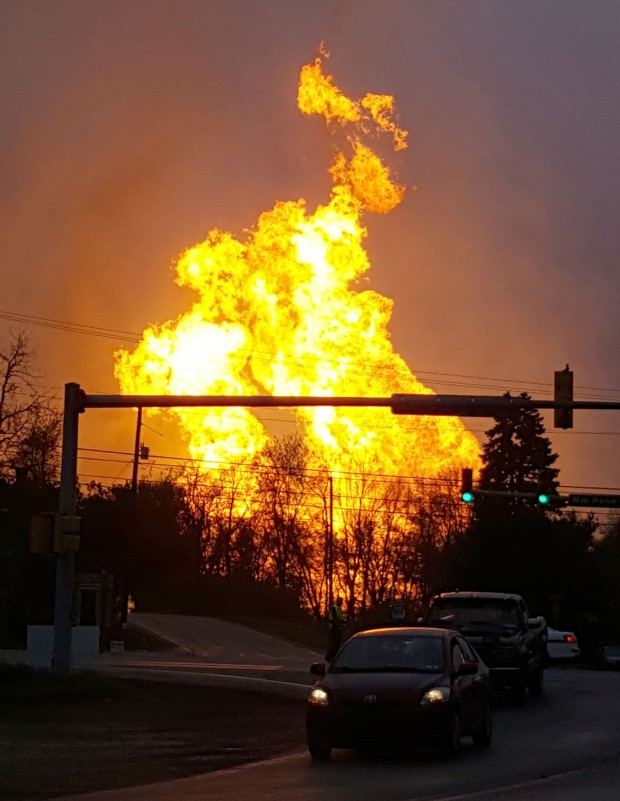 The explosion, which burned one person, caused flames to shoot above nearby treetops in the largely rural Salem Township, about 30 miles east of Pittsburgh, and prompted authorities to evacuate homes and businesses nearby.