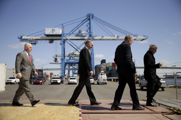 From left,  Holt Logistics President Leo Holt, U.S. Sen. Bob Casey, D-Pa., Philadelphia Regional Port Authority (PRPA) Executive Director James McDermott, Jr. and Chairman of PRPA walk off a platform at the end of a news confrere to call for calling for federal officials to provide funding for a Delaware River dredging project, Friday, April 24, 2015, in Philadelphia. A Casey spokesman said the second-term Democrat plans to send an email to supporters on Friday announcing his support for Hillary Rodham Clinton for president. 