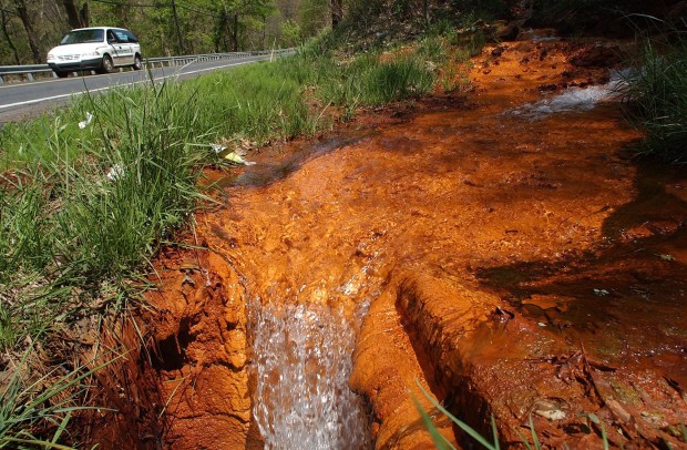 Acid mine drainage from the Potts Colliery near Shamokin, Pa., stains the creek bed orange.