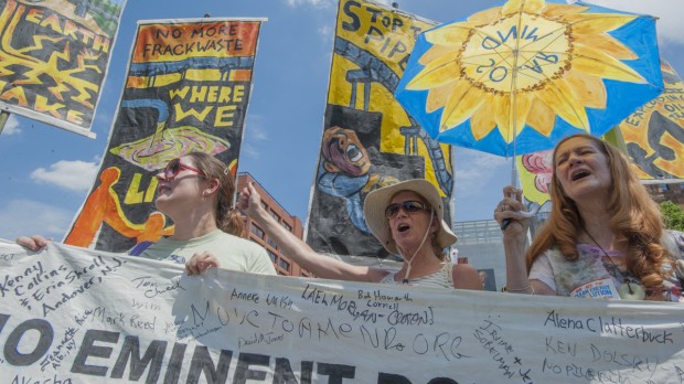 Opponents of the Algonquin Pipeline cheer speakers at a rally after the clean energy march in Philadelphia Sunday afternoon.