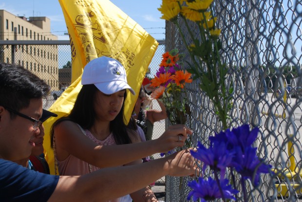 Environmentalists and community activists fixed flowers to the perimeter fence at Philadelphia Energy Solutions during a demonstration calling on the refiner to rethink its plans to expand at the proposed Southport marine terminal. 