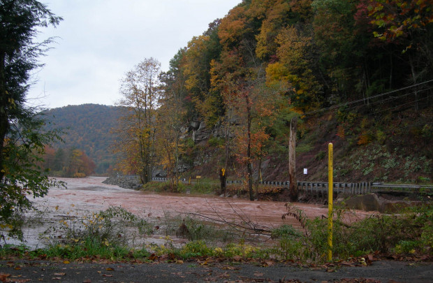 Heavy rains brought flash floods to Lycoming County, which washed out a bridge  on Wallis Run Road. The yellow pipeline marker shows the location of the Sunoco pipeline that ruptured and spilled an estimated 55,000 gallons of gasoline into Wallis Run creek. 