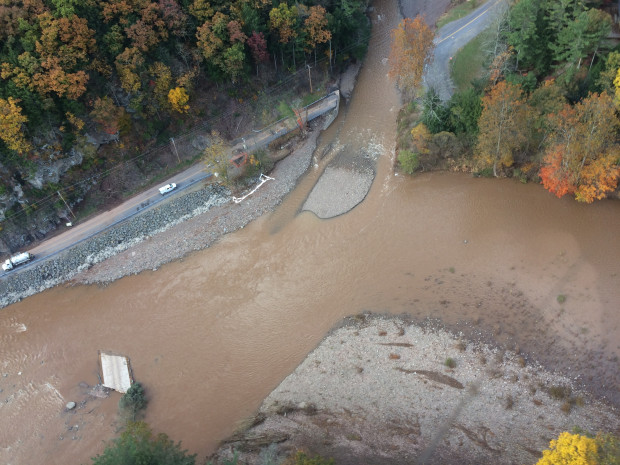 An aerial photo shows flood water damage of the roadway and the Wallis Run Bridge in Gamble, Pa. Sunoco officials say the bridge washed downstream and struck the pipeline, spilling an estimated 55,000 gallons of gasoline.