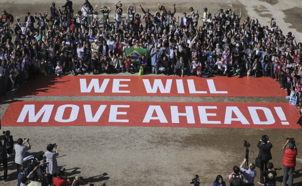 Participants at the COP22 climate conference stage a public show of support for climate negotiations and Paris agreement, on the last day of the conference, in Marrakech, Morocco, Friday, Nov. 18, 2016. 