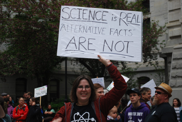 Woman holds a sign at the March for Science in Center City Philadelphia, April 22, 2017.