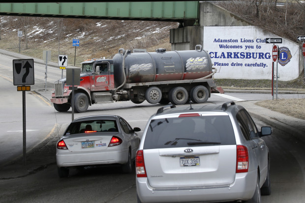 A truck carrying fracking waste water drives through an intersection in Clarksburg, W. Va.