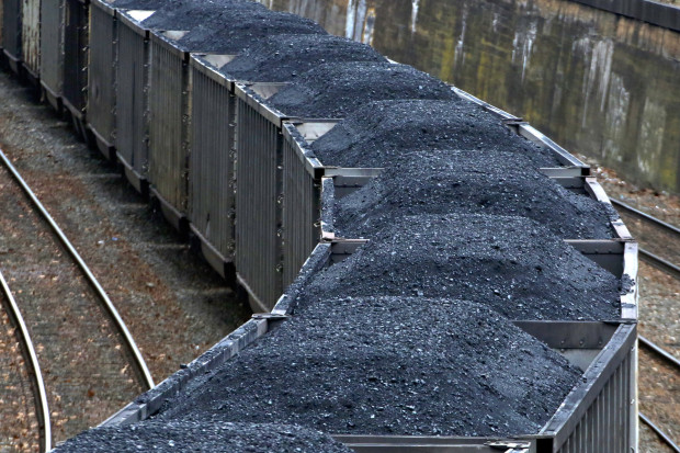 -A Norfolk Southern freight train hauling coal makes it way through downtown Pittsburgh Thursday, Jan. 26, 2017. The Department of Energy has proposed subsidizing coal and nuclear power in the face of competition from natural gas and renewables.