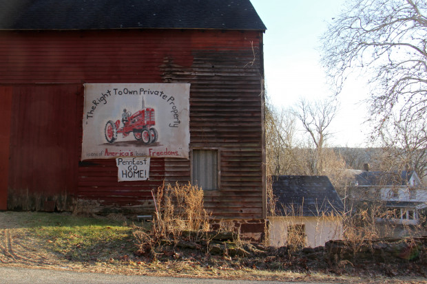 A sign on the side of a barn on Riegelsville Road in Holland Township, New Jersey, shows local opposition to the PennEast pipeline.