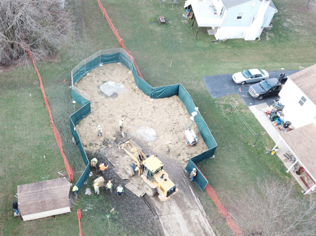 Crews work to stabilize sinkholes in a West Whiteland Township neighborhood on March 3. The sinkholes appeared recently near a construction site for the Mariner East 2 pipeline. 