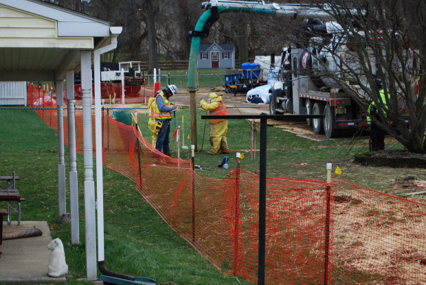 Pipeline workers probe the ground on Lisa Drive in West Whiteland Township where sinkholes have developed as a result of the Mariner East 2 construction. Vandalism to pipeline construction equipment has garnered two separate $10,000 rewards.