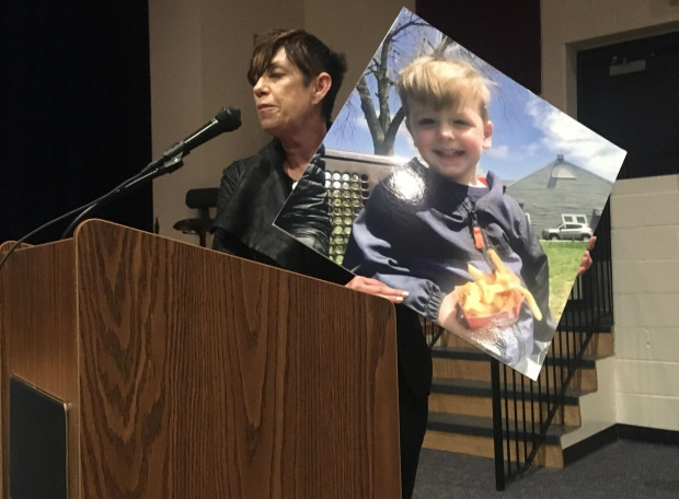 Denise McCarthy told a Department of Environmental Protection hearing that the Mariner East pipelines would endanger her grand nephew, Jack, whose picture she held up as she spoke. DEP held the public meeting to hear comment on Sunoco's proposed permit modifications in West Whiteland Township, Chester County. 